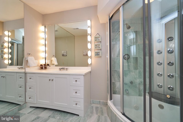 bathroom featuring vanity and tiled shower