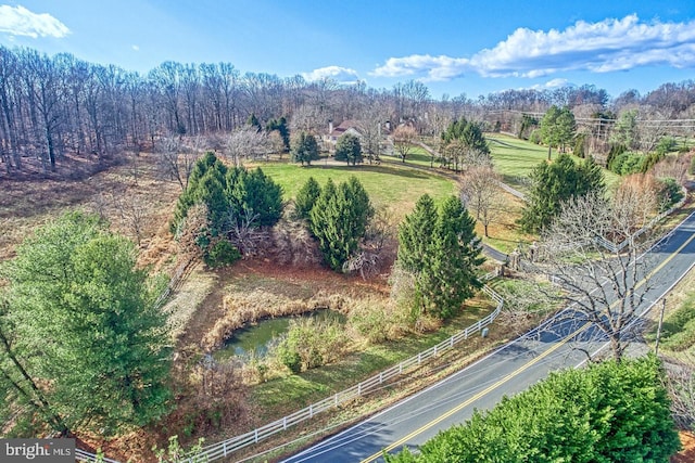 birds eye view of property with a rural view