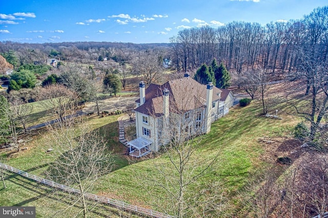 aerial view featuring a forest view