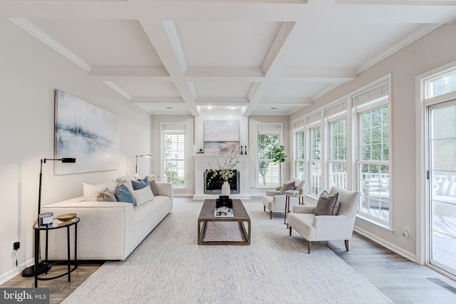 living room with a fireplace, visible vents, wood finished floors, coffered ceiling, and beamed ceiling