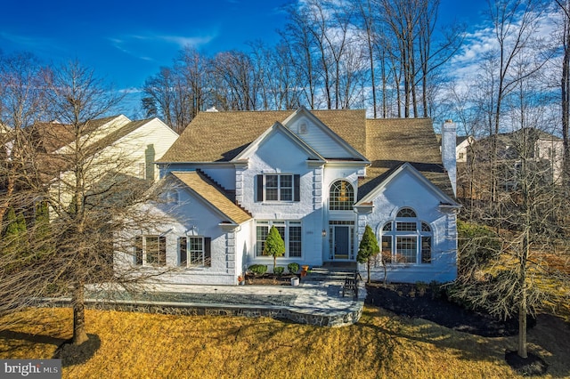 view of front of home with a chimney