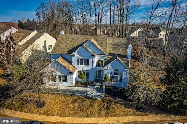 view of front of home featuring a chimney