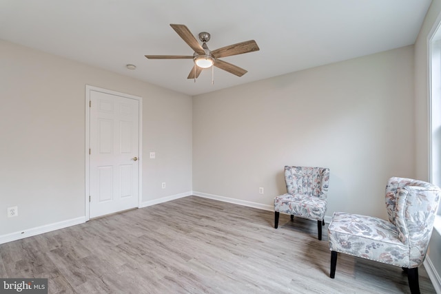 unfurnished room featuring ceiling fan, baseboards, and wood finished floors