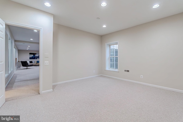 unfurnished room featuring baseboards, carpet flooring, and recessed lighting