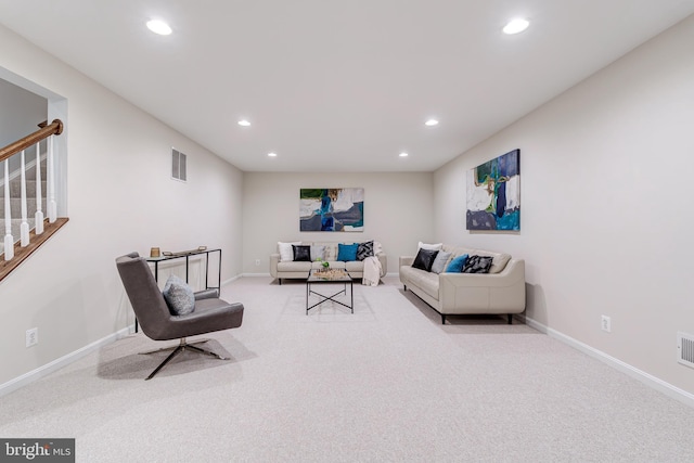 carpeted living room featuring recessed lighting, visible vents, stairway, and baseboards