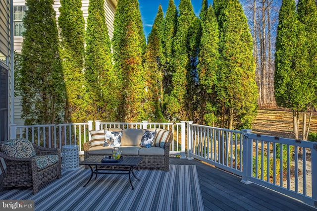 wooden terrace with outdoor lounge area