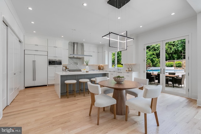 5914 Woodley Rd, Mclean, VA 22101 - dining space featuring light wood-style flooring, recessed lighting, and crown molding