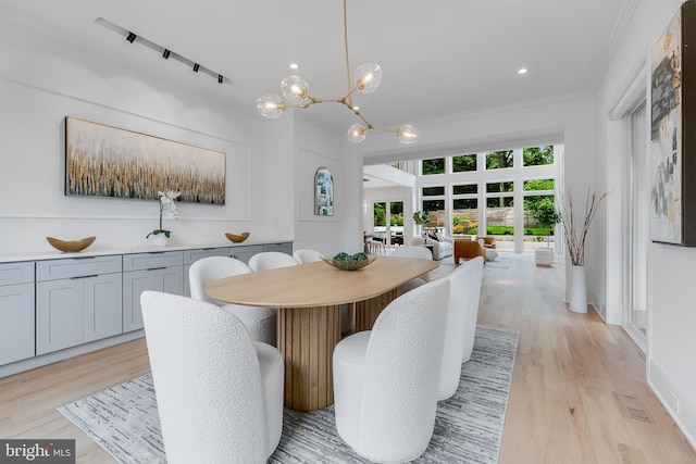 5914 Woodley Rd, Mclean, VA 22101 - dining room featuring crown molding, light wood-type flooring, a chandelier, and recessed lighting