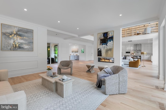 5914 Woodley Rd, Mclean, VA 22101 - living area featuring crown molding, wood finished floors, a glass covered fireplace, and recessed lighting
