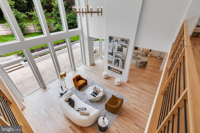 5914 Woodley Rd, Mclean, VA 22101 - living area with a high ceiling, wood finished floors, and a chandelier