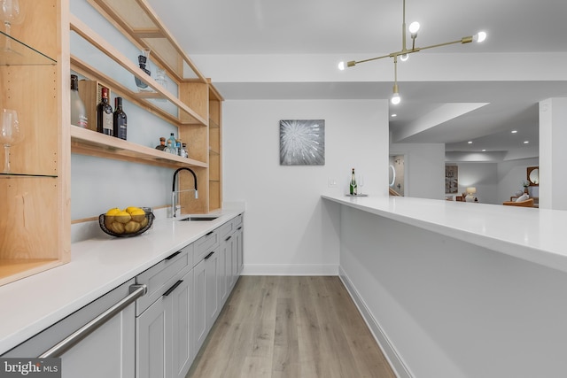 5914 Woodley Rd, Mclean, VA 22101 - bar featuring a sink, light wood-style flooring, baseboards, decorative light fixtures, and recessed lighting