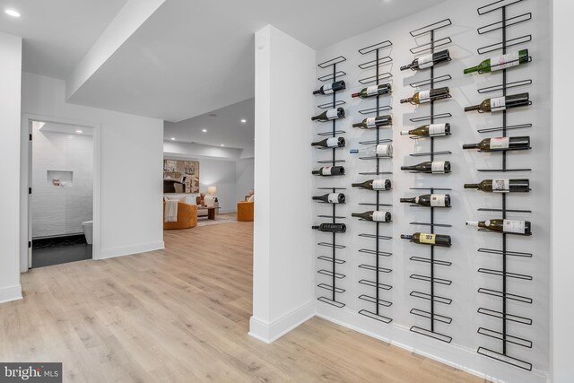 5914 Woodley Rd, Mclean, VA 22101 - wine cellar featuring baseboards, wood finished floors, and recessed lighting