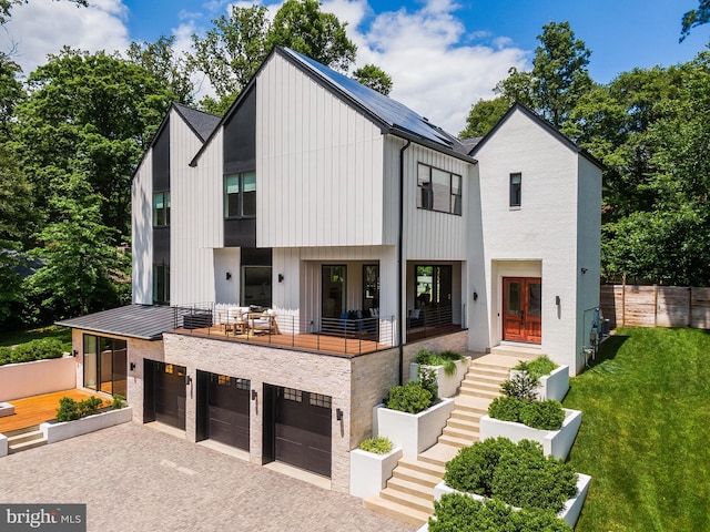 5914 Woodley Rd, Mclean, VA 22101 - view of front of house with stairway, driveway, an attached garage, and board and batten siding