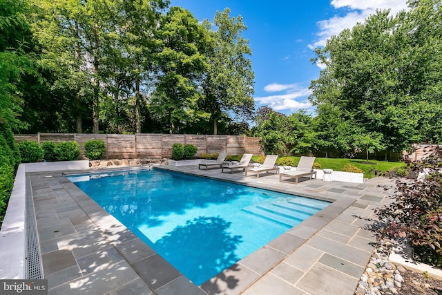 5914 Woodley Rd, Mclean, VA 22101 - view of swimming pool featuring a patio, a fenced backyard, and view of scattered trees