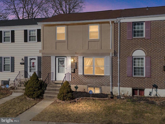 view of property with brick siding