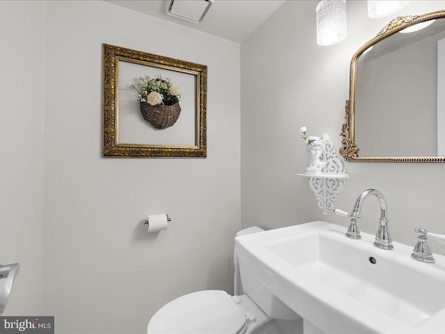 bathroom with a sink and toilet