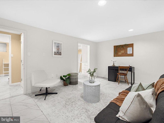 living area featuring recessed lighting, marble finish floor, and baseboards