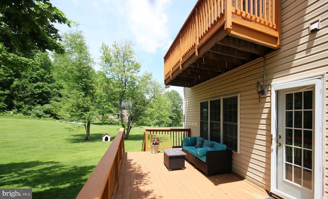 deck with an outdoor living space and a yard