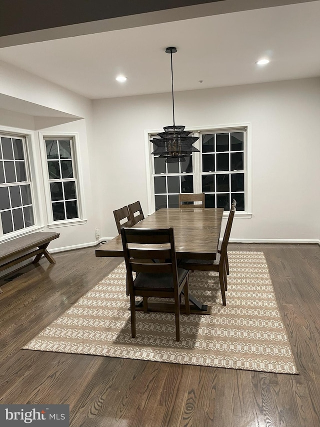 dining space with baseboards, dark wood-style flooring, and recessed lighting