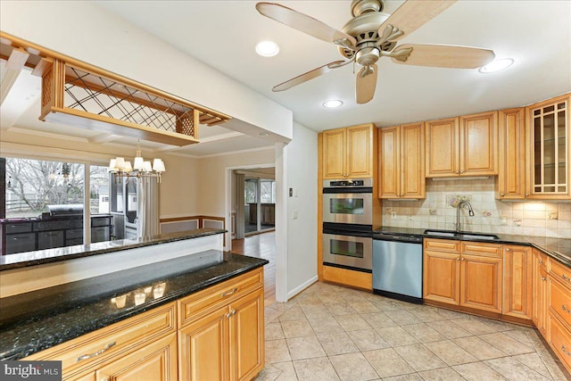 kitchen with stainless steel appliances, a sink, decorative backsplash, glass insert cabinets, and crown molding