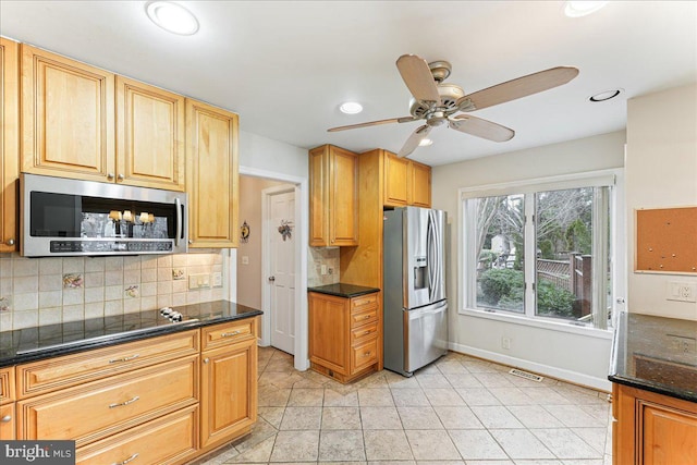 kitchen featuring recessed lighting, visible vents, backsplash, appliances with stainless steel finishes, and baseboards