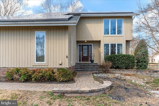 view of front of house with solar panels