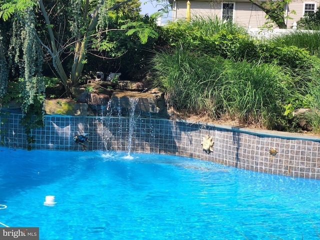 view of pool with fence