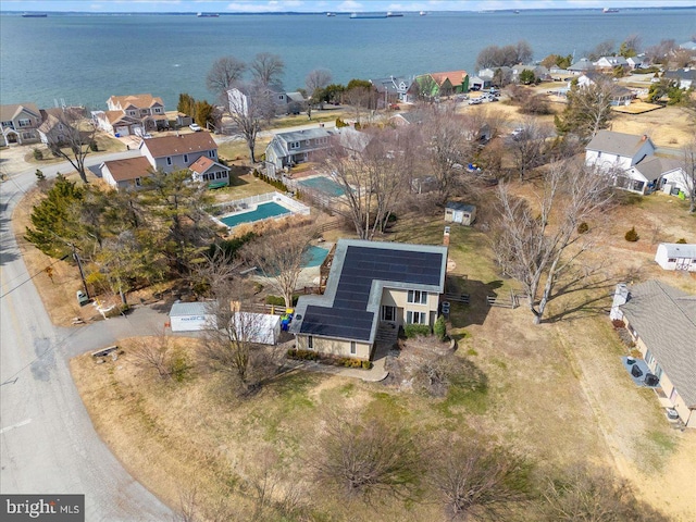 aerial view featuring a water view and a residential view