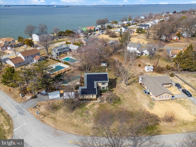 bird's eye view featuring a residential view and a water view