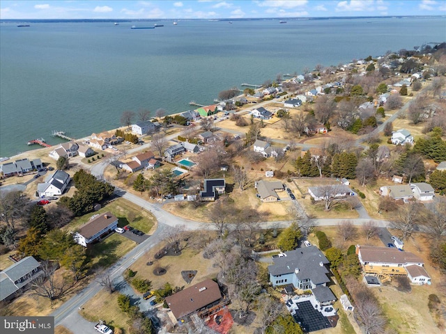 bird's eye view with a water view and a residential view