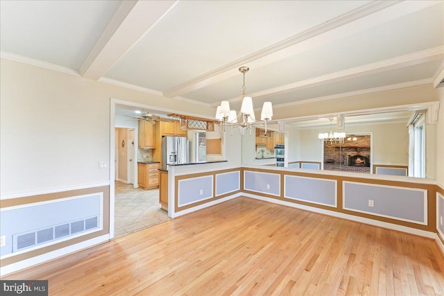 kitchen featuring beam ceiling, stainless steel refrigerator with ice dispenser, visible vents, an inviting chandelier, and light wood-style floors