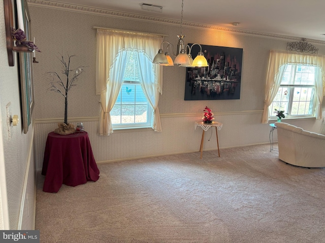 interior space featuring wallpapered walls, plenty of natural light, visible vents, and carpet flooring