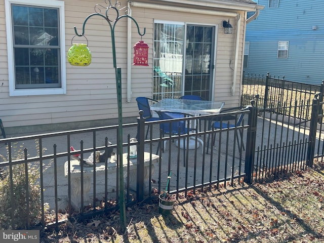 view of patio / terrace featuring fence and outdoor dining area