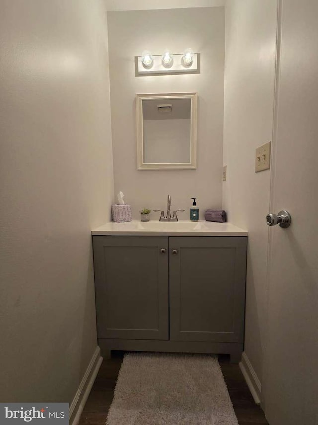 bathroom with vanity and baseboards