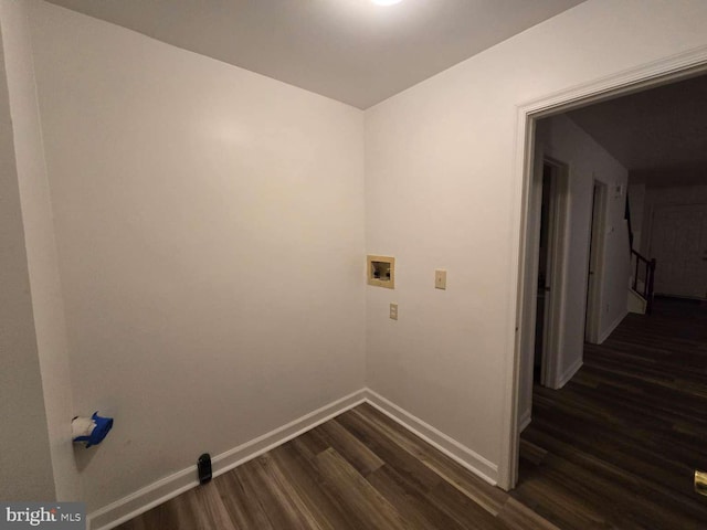 clothes washing area featuring dark wood-style floors, baseboards, laundry area, and washer hookup