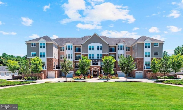 view of community featuring a yard