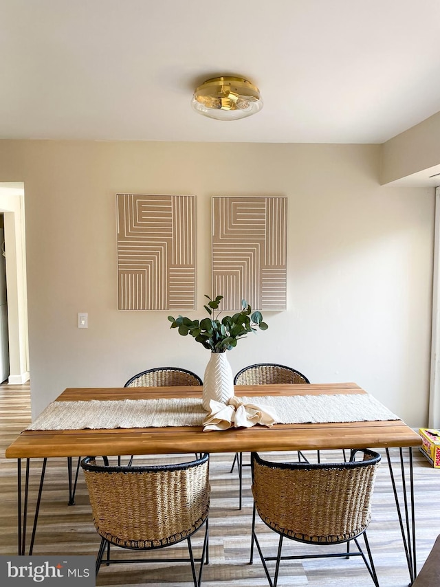 dining space featuring wood finished floors