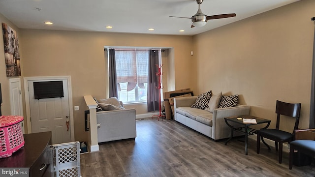 living room featuring ceiling fan, baseboards, wood finished floors, and recessed lighting