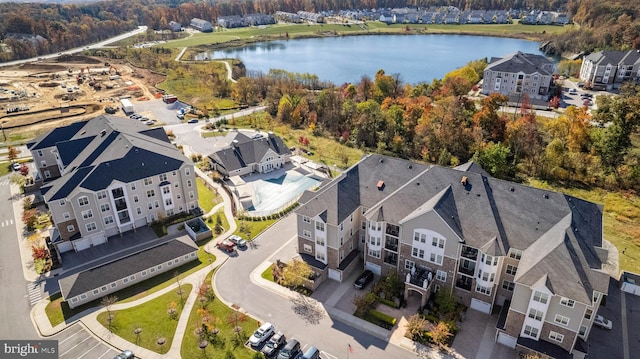 bird's eye view featuring a water view and a residential view