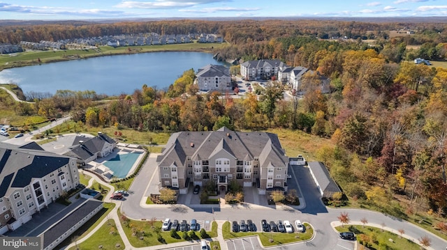 birds eye view of property with a forest view and a water view