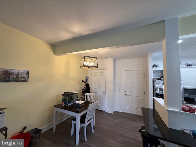 home office with an inviting chandelier, baseboards, dark wood finished floors, and beamed ceiling