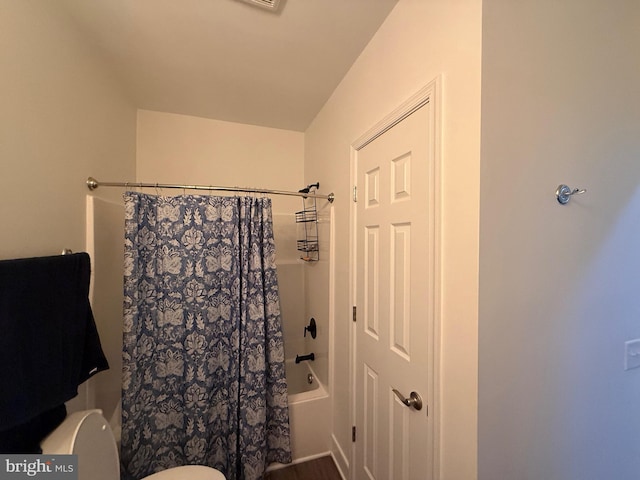 full bathroom with shower / tub combo and toilet