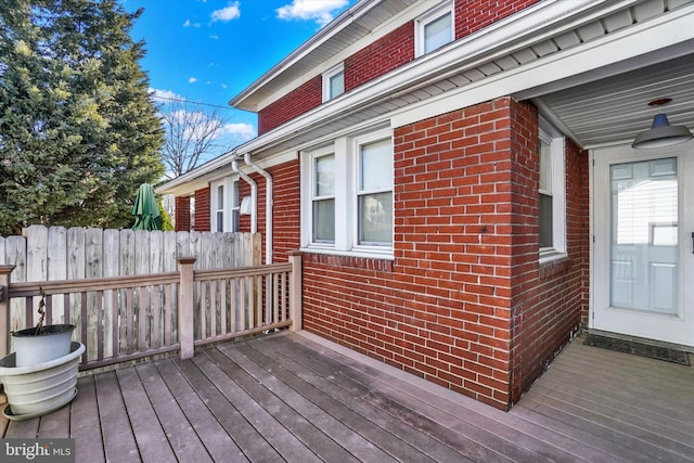 wooden deck featuring fence