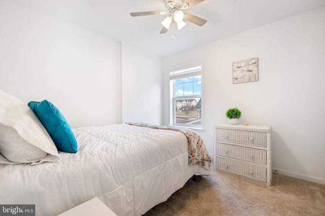 bedroom with carpet flooring, a ceiling fan, and baseboards