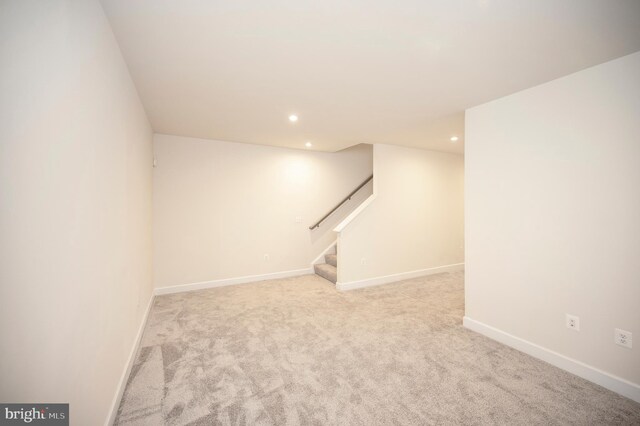 finished below grade area featuring carpet floors, recessed lighting, stairway, and baseboards