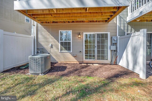 view of patio / terrace with central AC unit and fence