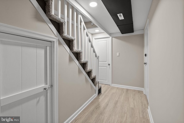 interior space with baseboards and wood finished floors