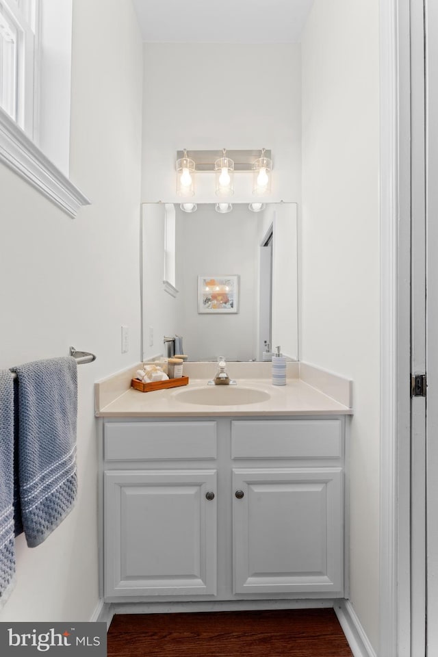 bathroom with vanity and baseboards