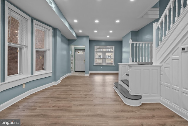 foyer with recessed lighting, visible vents, light wood finished floors, and baseboards