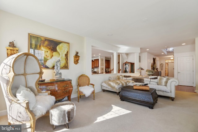 living room with recessed lighting and light carpet